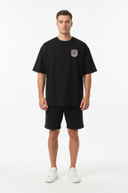 Front view - male model in black TEN ATTIRE tee