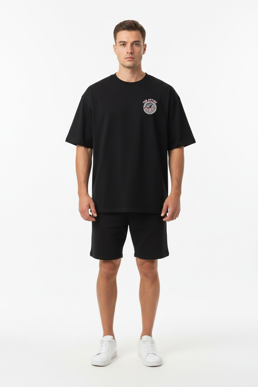 Front view - male model in black TEN ATTIRE tee