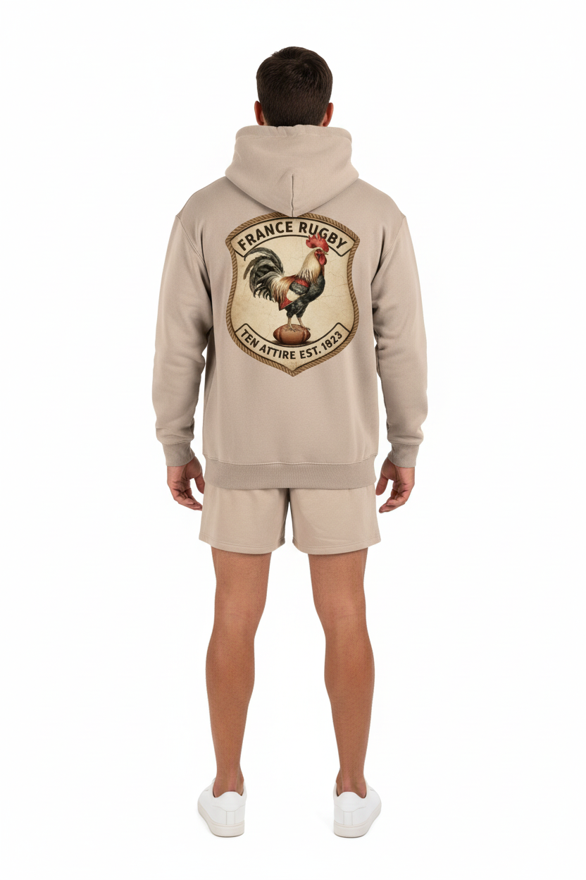 Full body back view of male model wearing beige French rugby rooster hoodie
