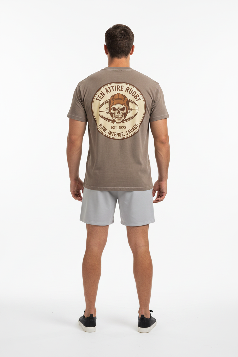 Full body back view of male model wearing brown Ten Attire Rugby skull badge tee