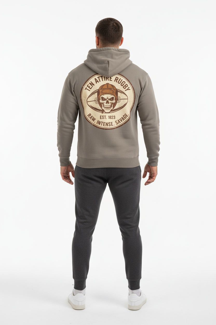 Full body back view of male model wearing grey Ten Attire Rugby skull badge hoodie