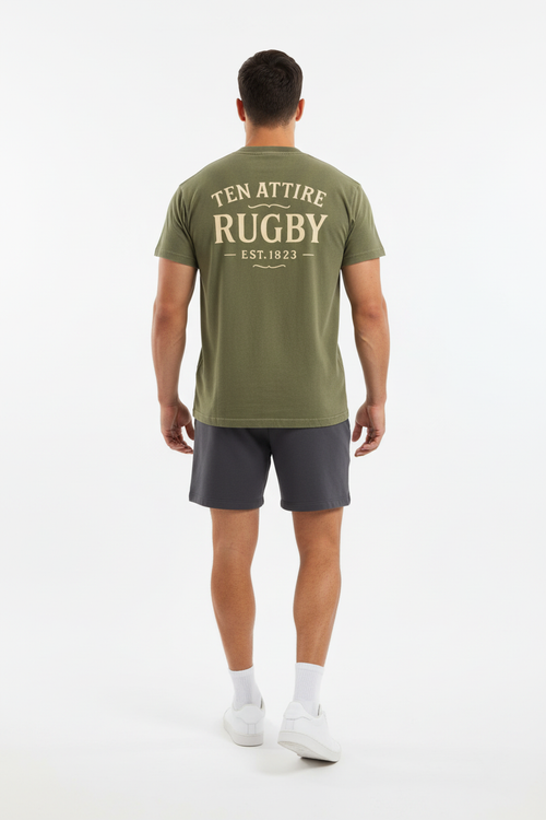 Full body back view of male model wearing olive green Ten Attire Rugby tee