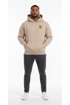 Full body front view of male model wearing beige French rugby rooster hoodie