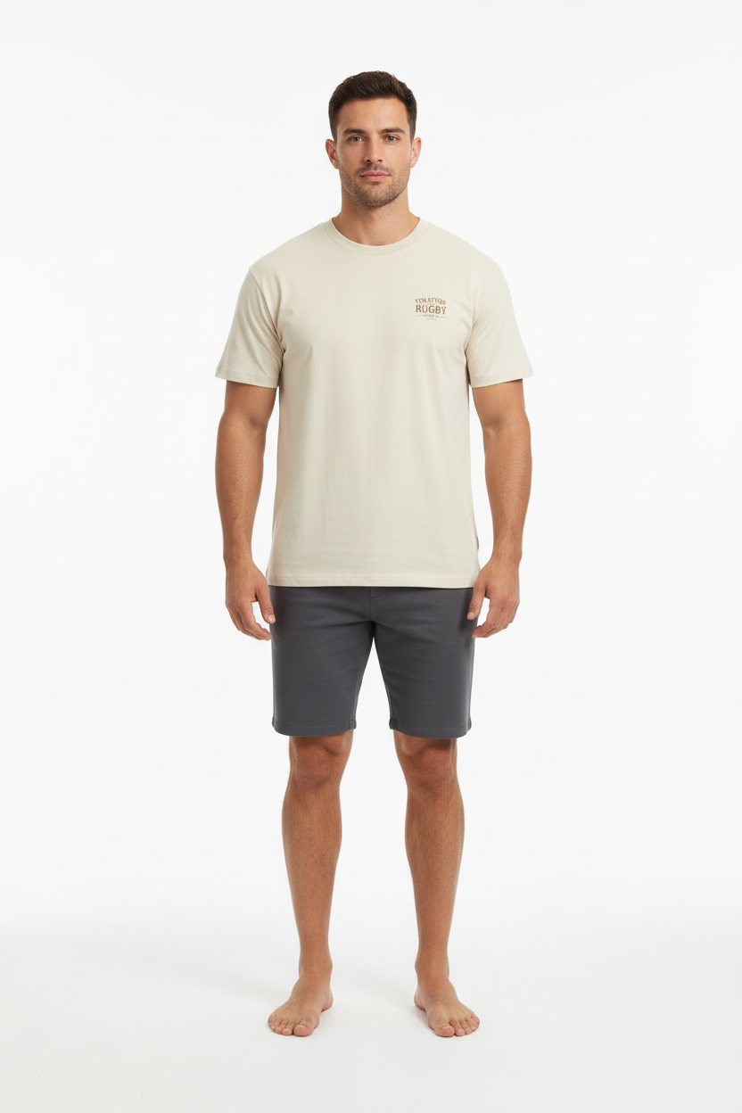 Full body front view of male model wearing cream Ten Attire Rugby tee