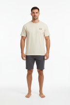 Full body front view of male model wearing cream Ten Attire Rugby tee
