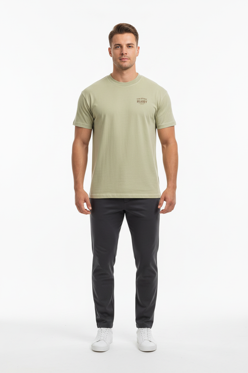 Full body front view of male model wearing sage green Ten Attire Rugby tee